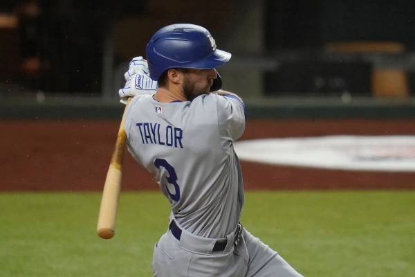 Los Angeles Dodgers' Chris Taylor bats in Game 3 of a baseball National League Division Series ...