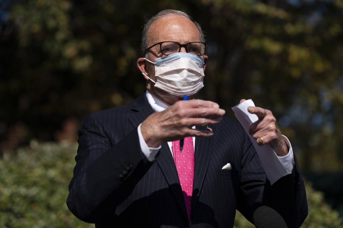 White House chief economic adviser Larry Kudlow talks with reporters outside the White House ab ...