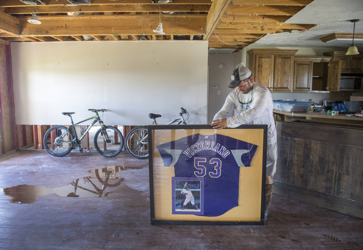 A former baseball player with LSU, Gerard Victoriano, Jr., salvages his old jersey the morning ...