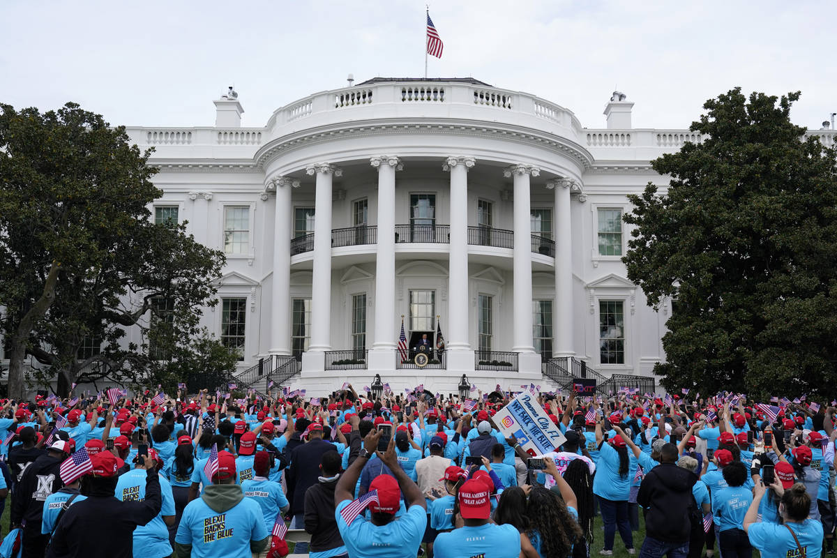 President Donald Trump speaks from the Blue Room Balcony of the White House to a crowd of suppo ...