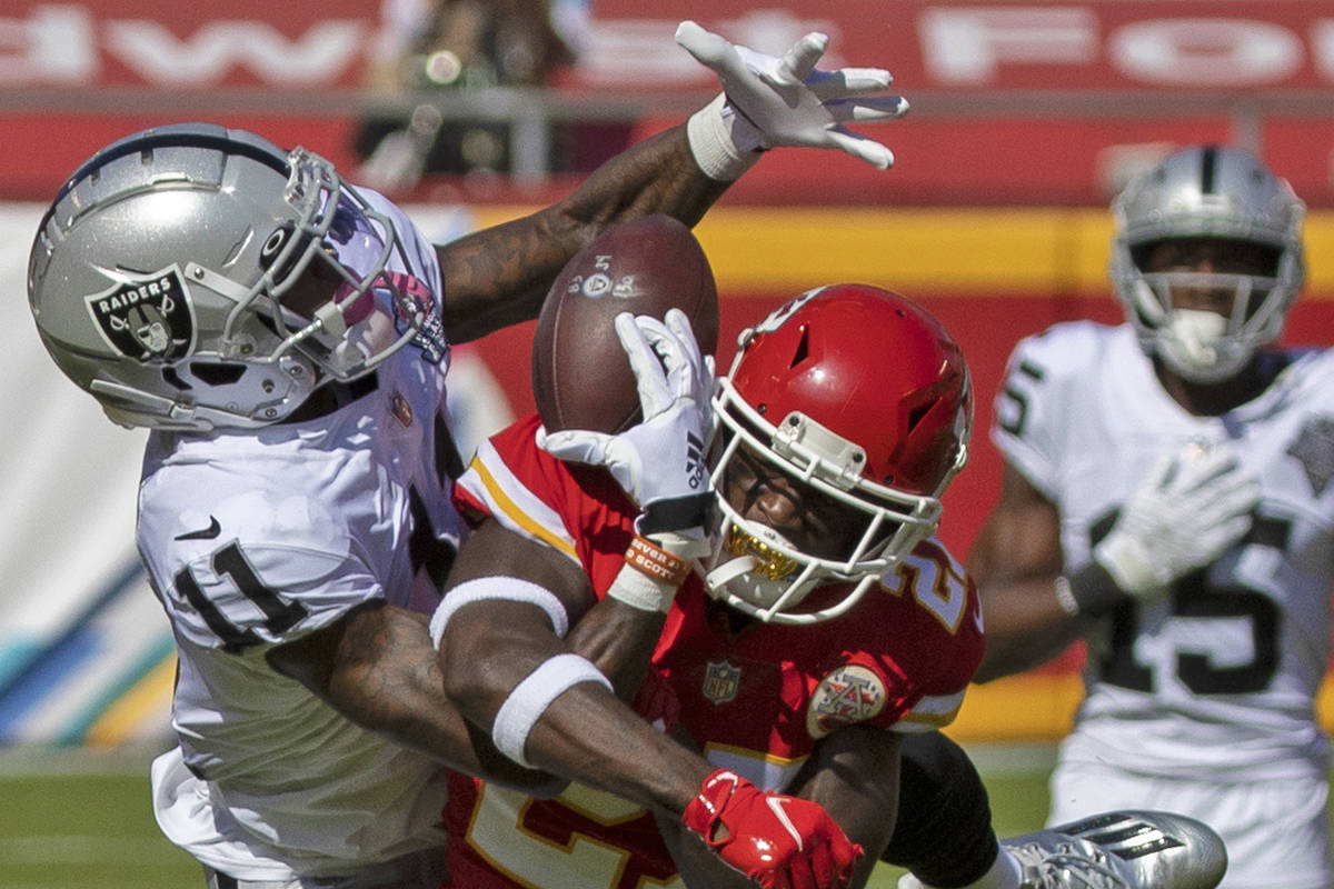 Las Vegas Raiders wide receiver Henry Ruggs III (11) pulls in an acrobatic catch over Kansas Ci ...