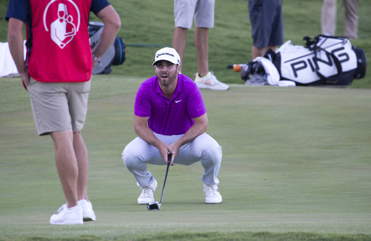 Matthew Wolff reacts after missing a putt on the 18th hole during a playoff in the final round ...