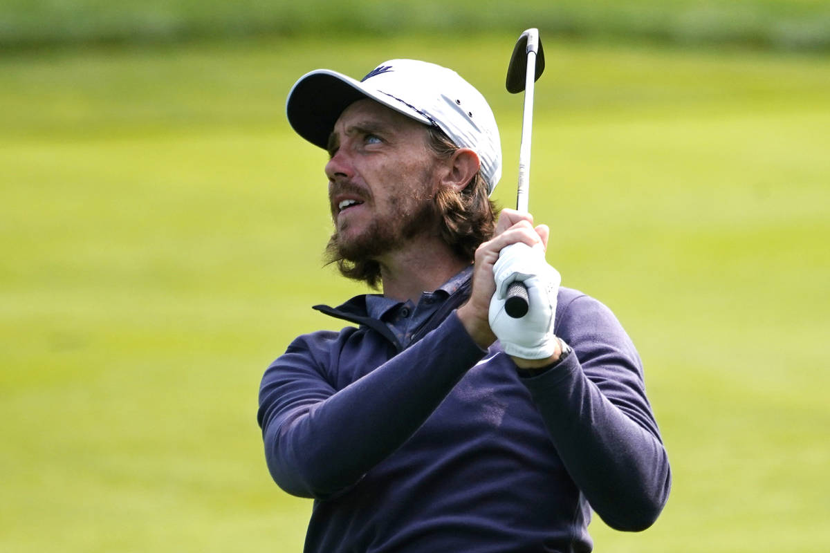 Tommy Fleetwood, of England, watches his shot from the 11th fairway during a practice round bef ...