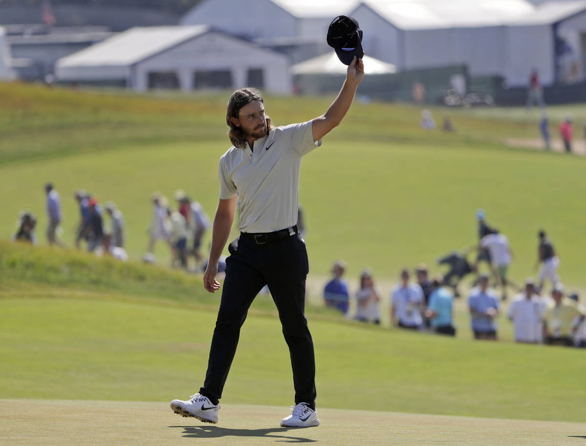 Tommy Fleetwood of England, waves to spectators after finishing the final round of the U.S. Ope ...
