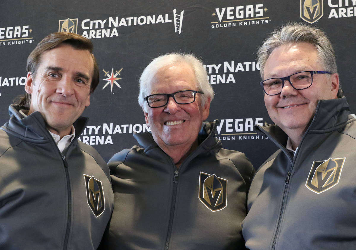 Golden Knights owner Bill Foley, center, President of Hockey Operation George McPhee, left, and ...