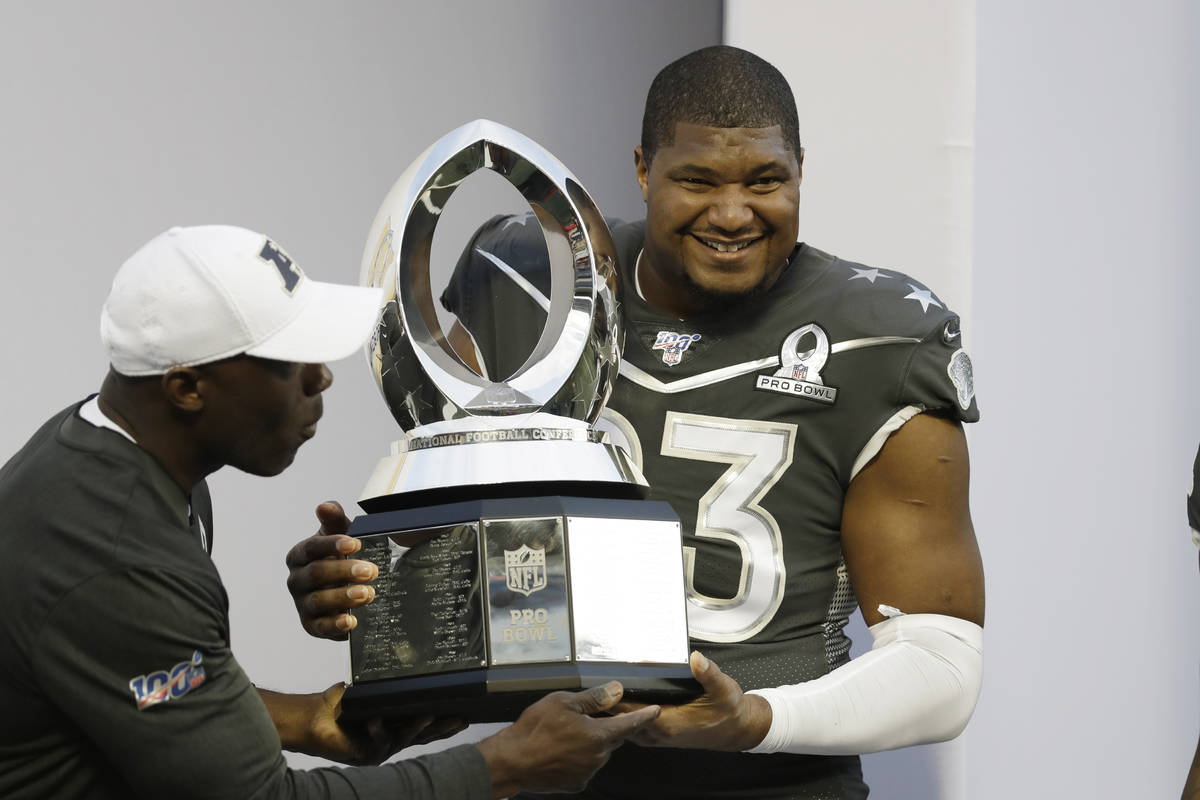 AFC defensive end Calais Campbell, of the Jacksonville Jaguars, (93) holds the Pro Bowl trophy ...