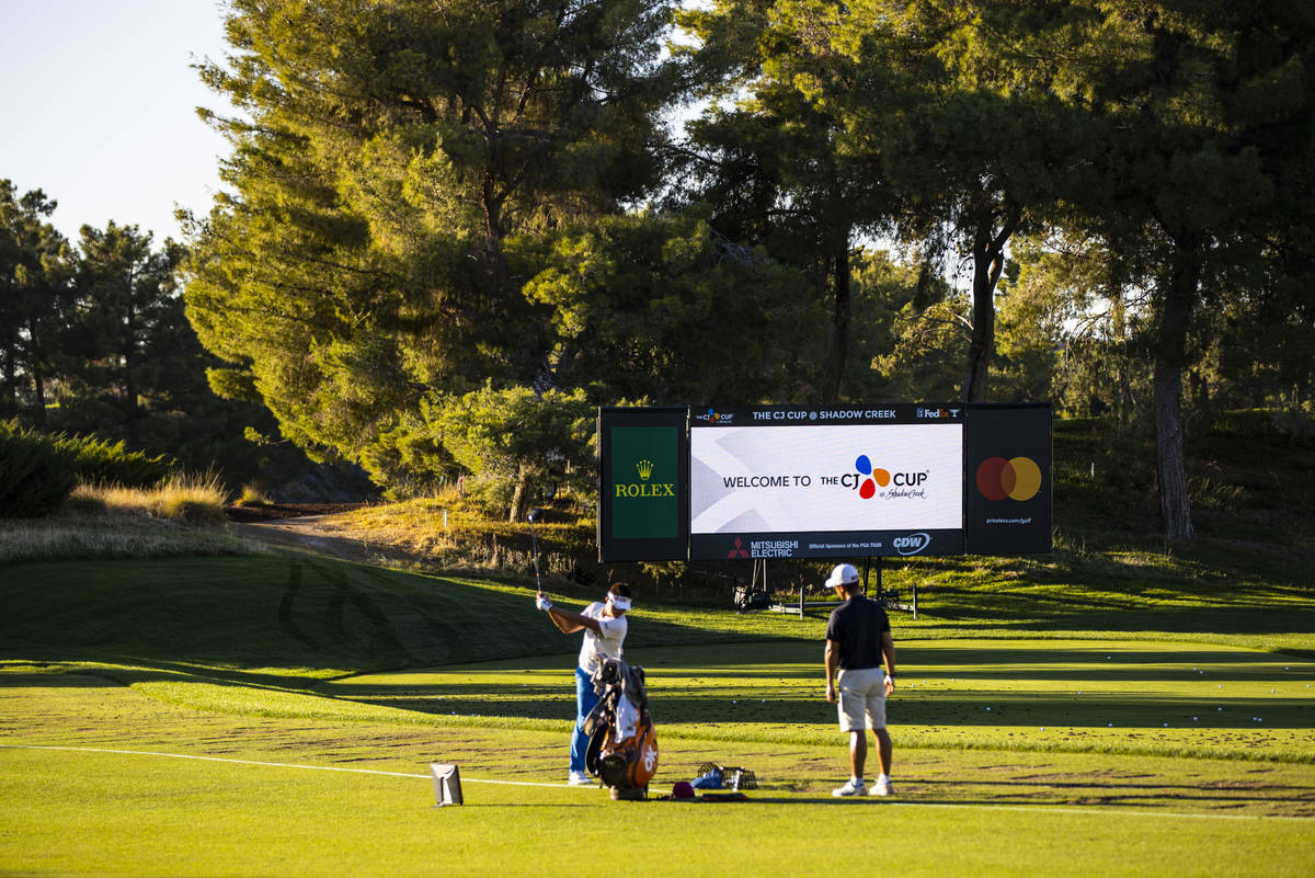 A golfer warms up in the driving range ahead of the CJ Cup at the Shadow Creek Golf Course in N ...