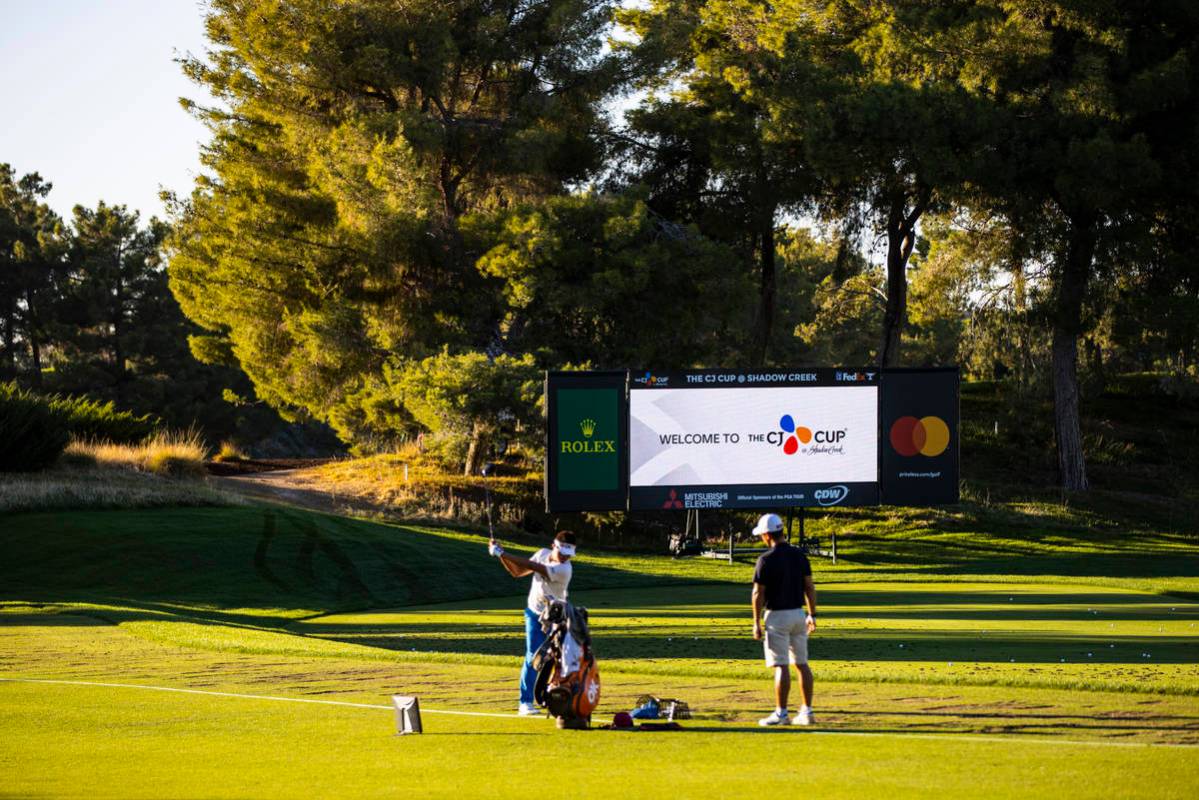 A golfer warms up in the driving range ahead of the CJ Cup at the Shadow Creek Golf Course in N ...