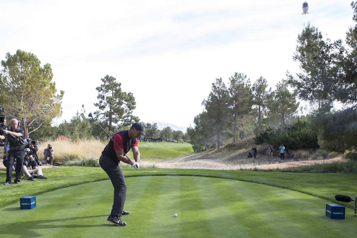 Tiger Woods hits from the second tee box during The Match at Shadow Creek Golf Course in North ...