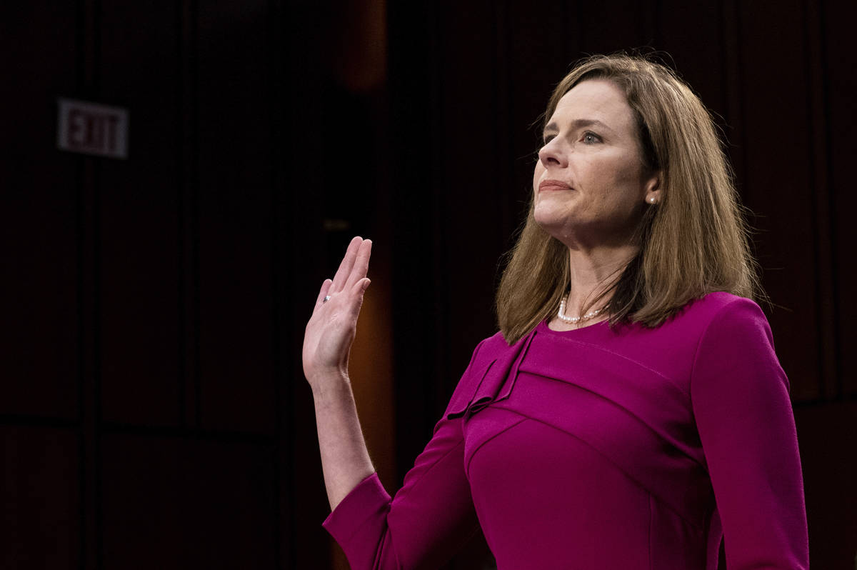 Supreme Court nominee Amy Coney Barrett is sworn in during her Senate Judiciary Committee confi ...