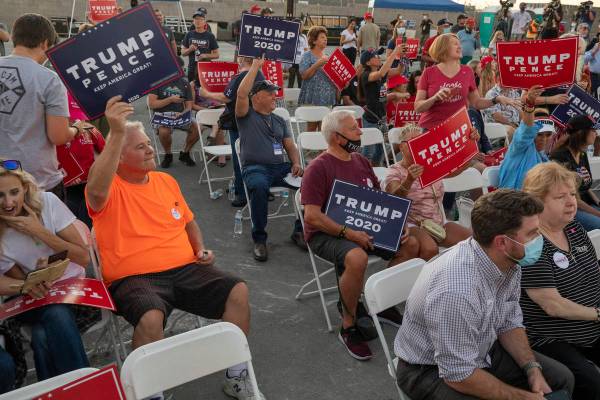 Attendees wait for Donald Trump Jr. to speak at a campaign event for President Trump on Wednesd ...