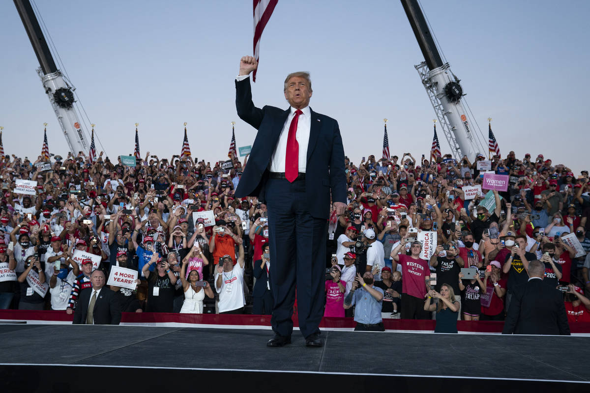 President Donald Trump arrives for a campaign rally at Orlando Sanford International Airport, M ...