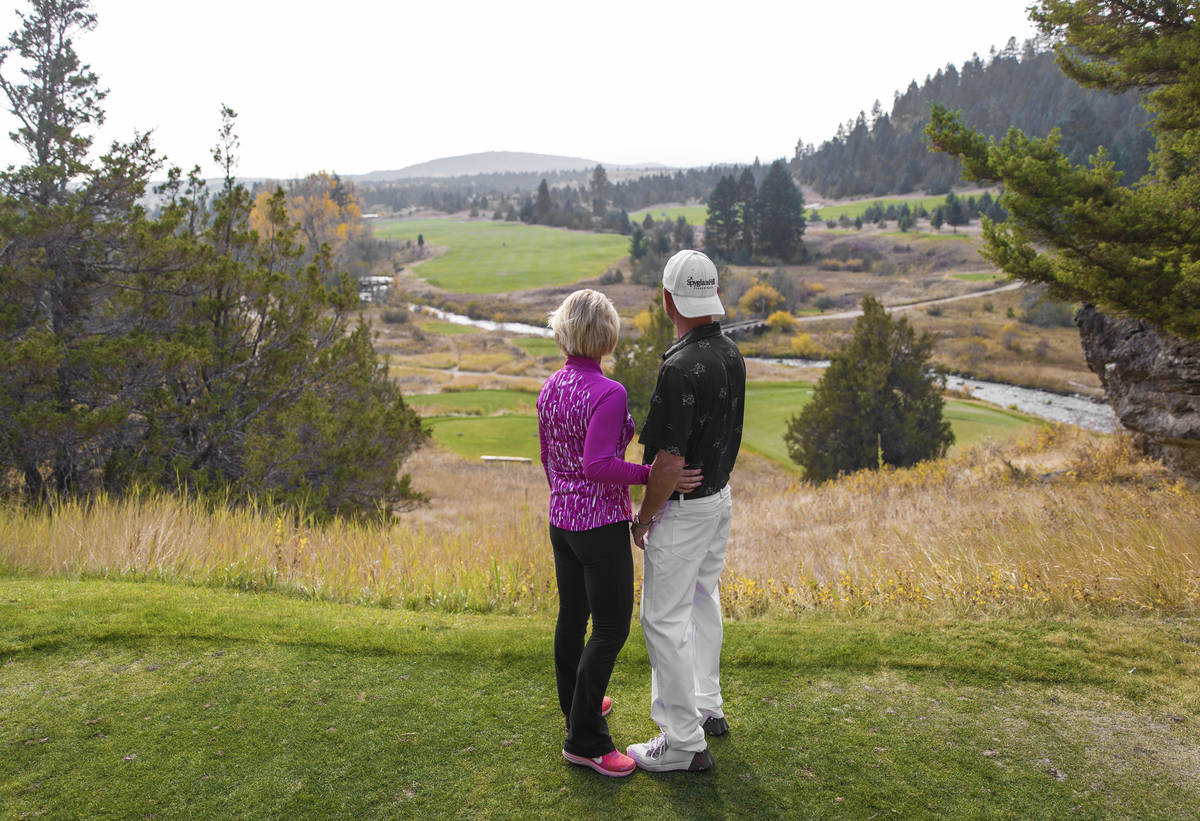 Las Vegans Gordon and Stacey Williams take in the view of the golf course at Rock Creek Cattle ...