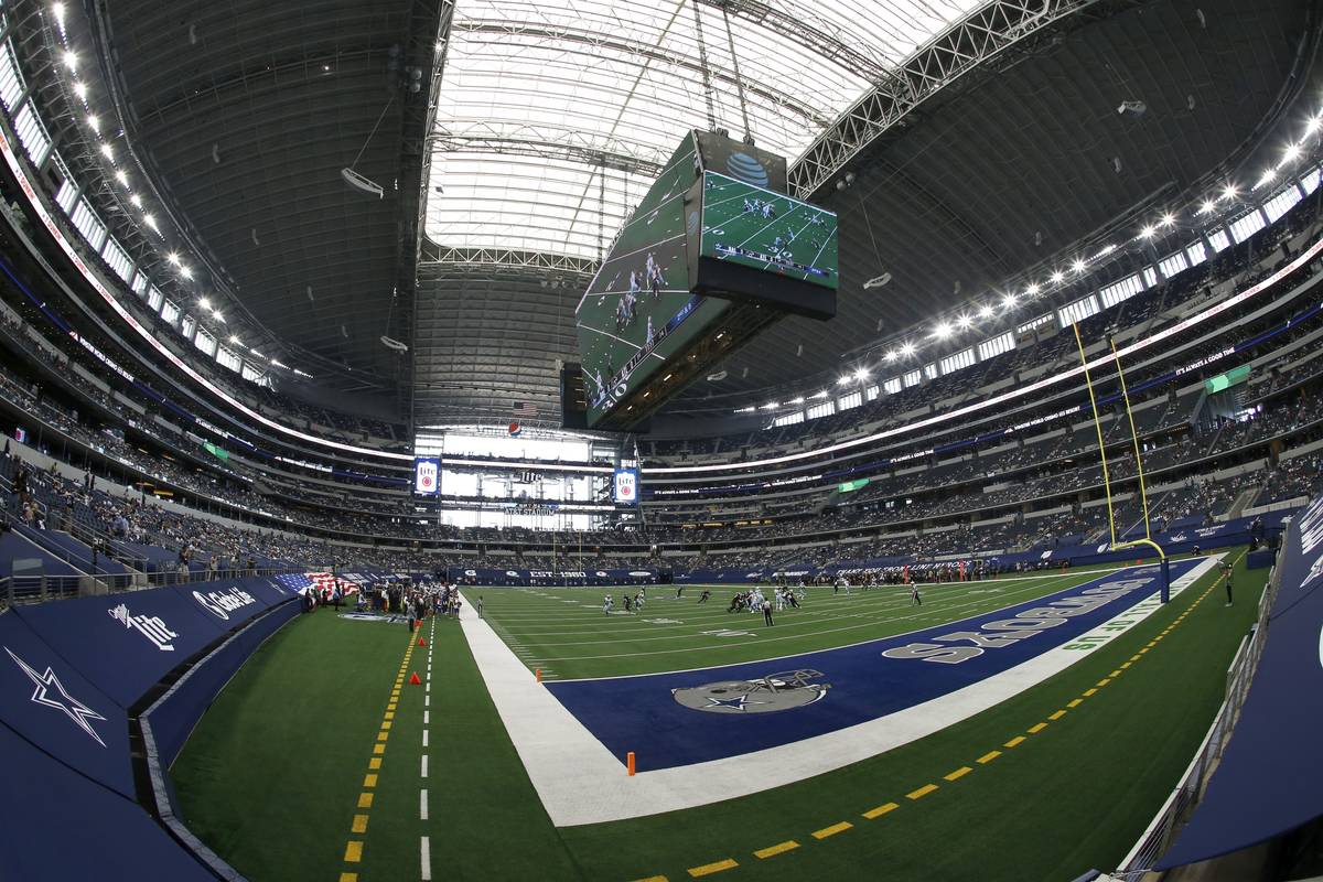 Fans watch as the Atlanta Falcons play the Dallas Cowboys at AT&T Stadium in the first half ...