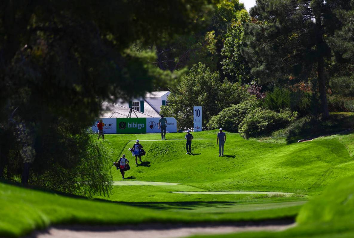 Golfers walk on the fairway of the 10th hole during the first round of the CJ Cup at the Shadow ...