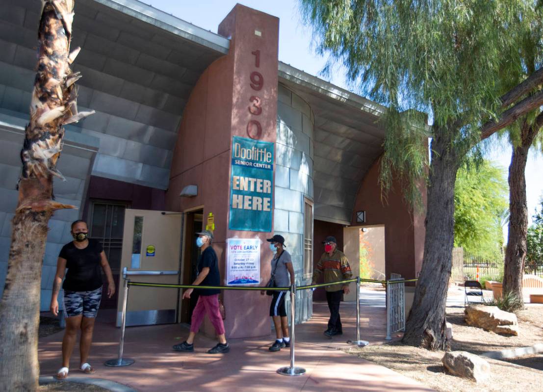 Early voters walk into a lineless Doolittle Community Center on Saturday, Oct. 17, 2020, in Las ...