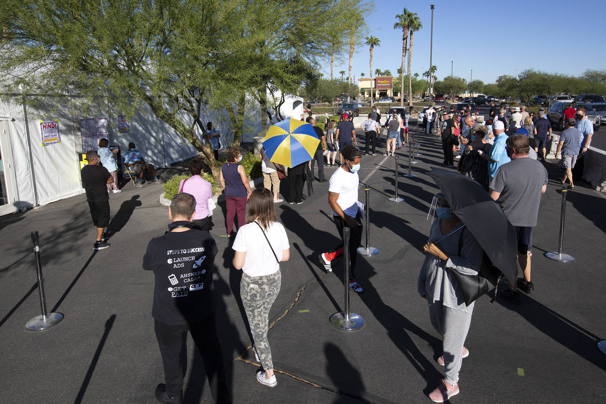 The line at the early voting location in the parking lot of Centennial Center Home Depot on Sat ...