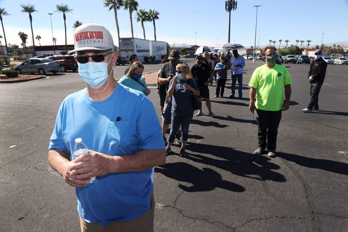 Harvey Weatherford of Henderson waits in line to cast his vote at the Galleria at Sunset pollin ...