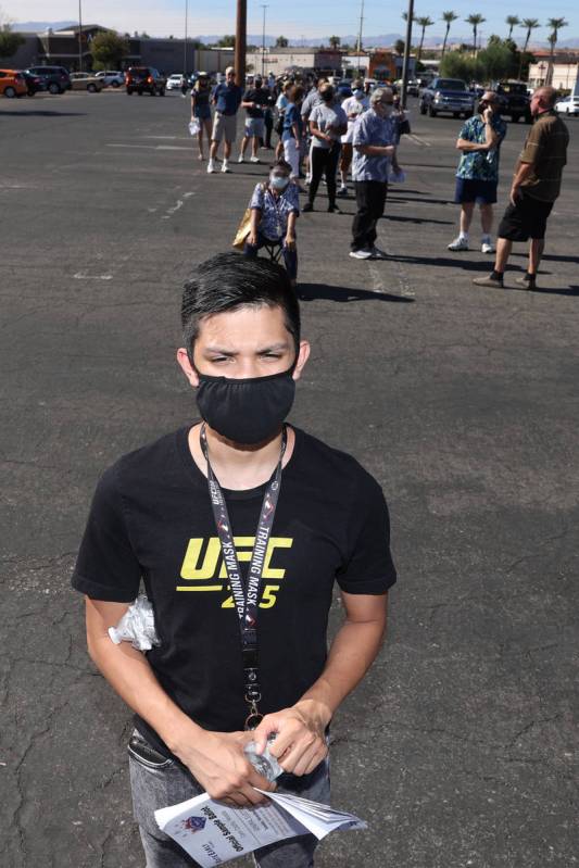 Angelo Cunanan of Henderson waits in line to cast his vote at the Galleria at Sunset polling lo ...