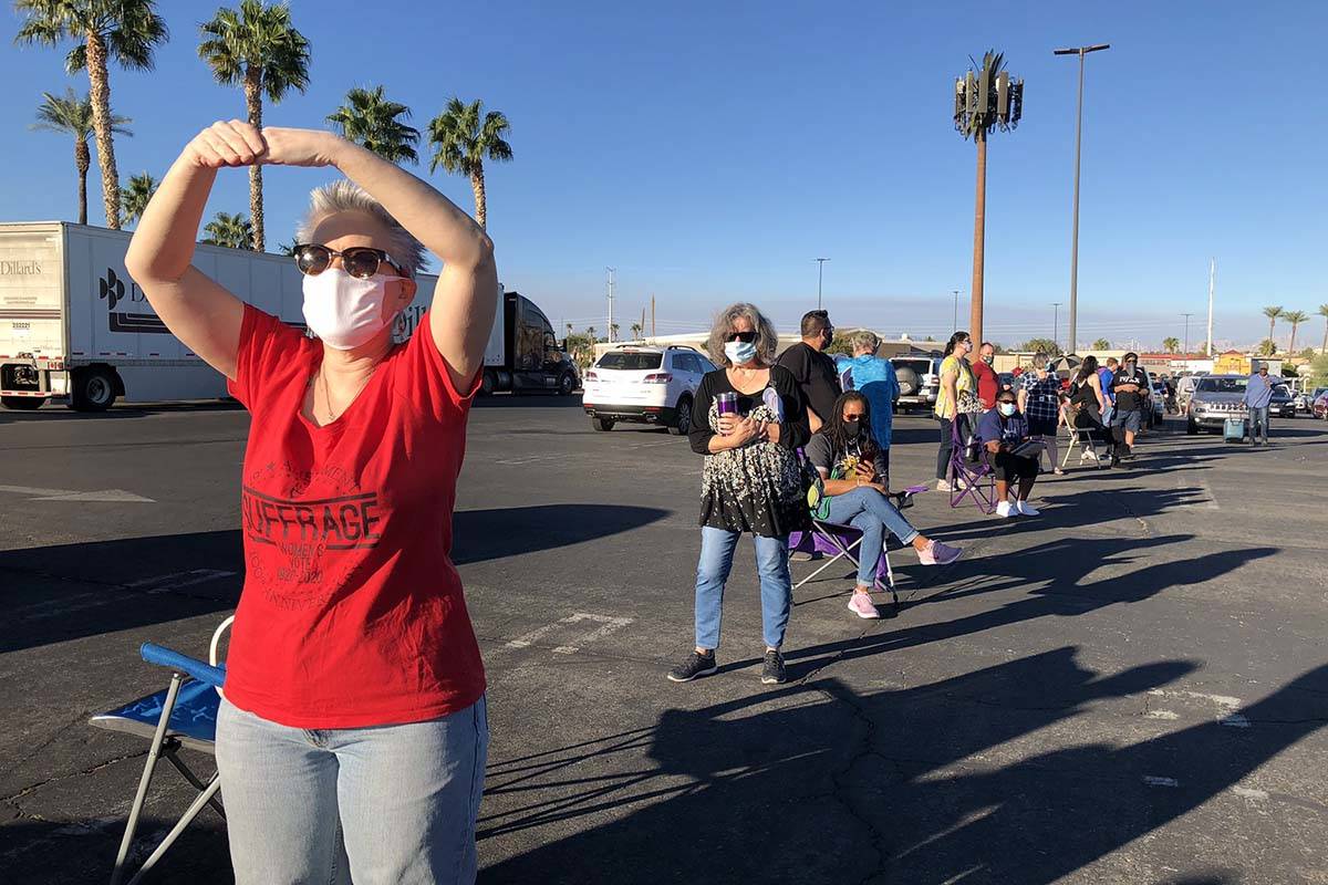 Voters line up earlier to cast ballots at Galleria mall in Henderson on Saturday morning, Oct. ...