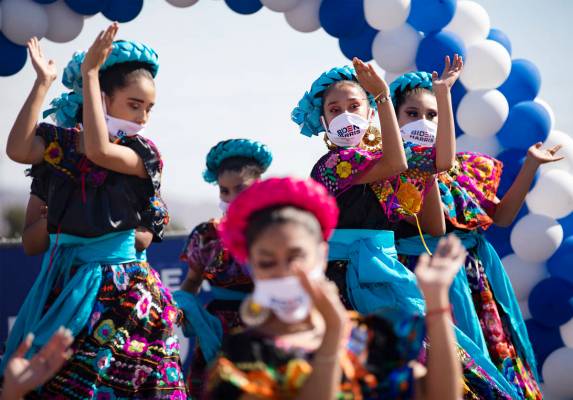 Members of the Mexico Vivo Dance Company perform at a democratic event to promote early voting ...