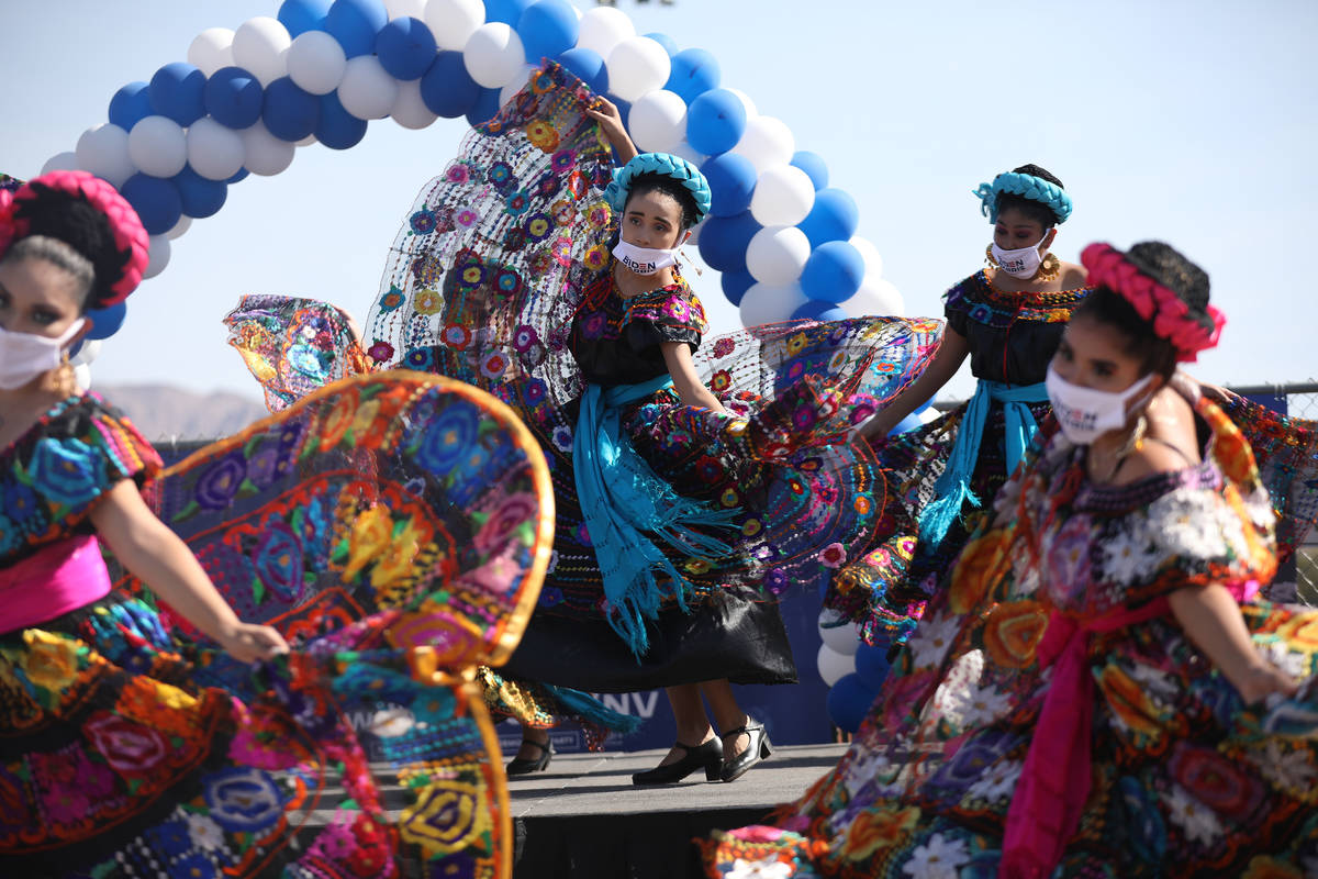 Members of the Mexico Vivo Dance Company perform at a democratic event to promote early voting ...