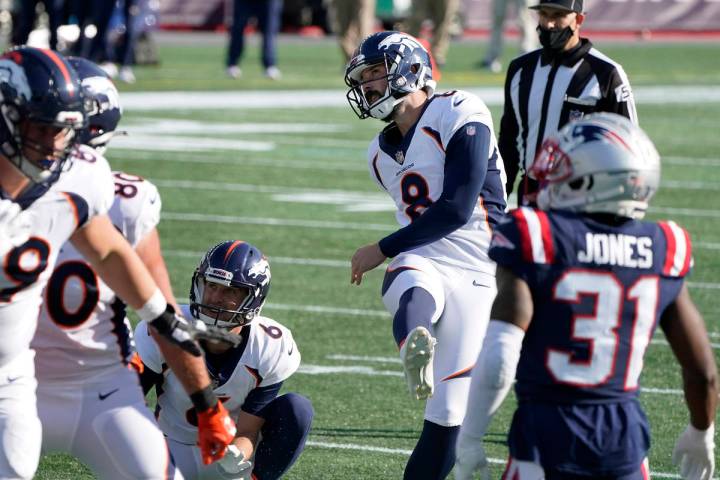 Denver Broncos place kicker Brandon McManus (8) follows through on one of his six field goals a ...