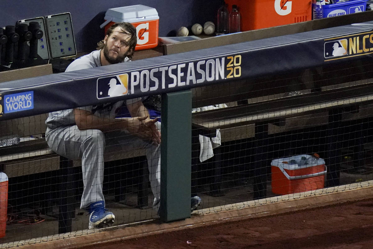 Los Angeles Dodgers starting pitcher Clayton Kershaw sits in the dugout after leaving the game ...