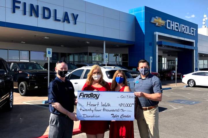 Findlay Auto Group CFO Tyler Corder, left, and Findlay Chevrolet General Manager Doug Fleming, ...