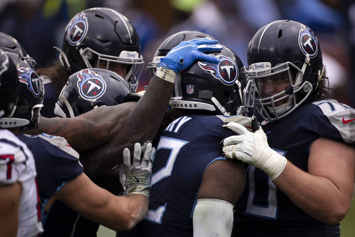 Tennessee Titans offensive tackle Ty Sambrailo (70) congratulates running back Derrick Henry (2 ...