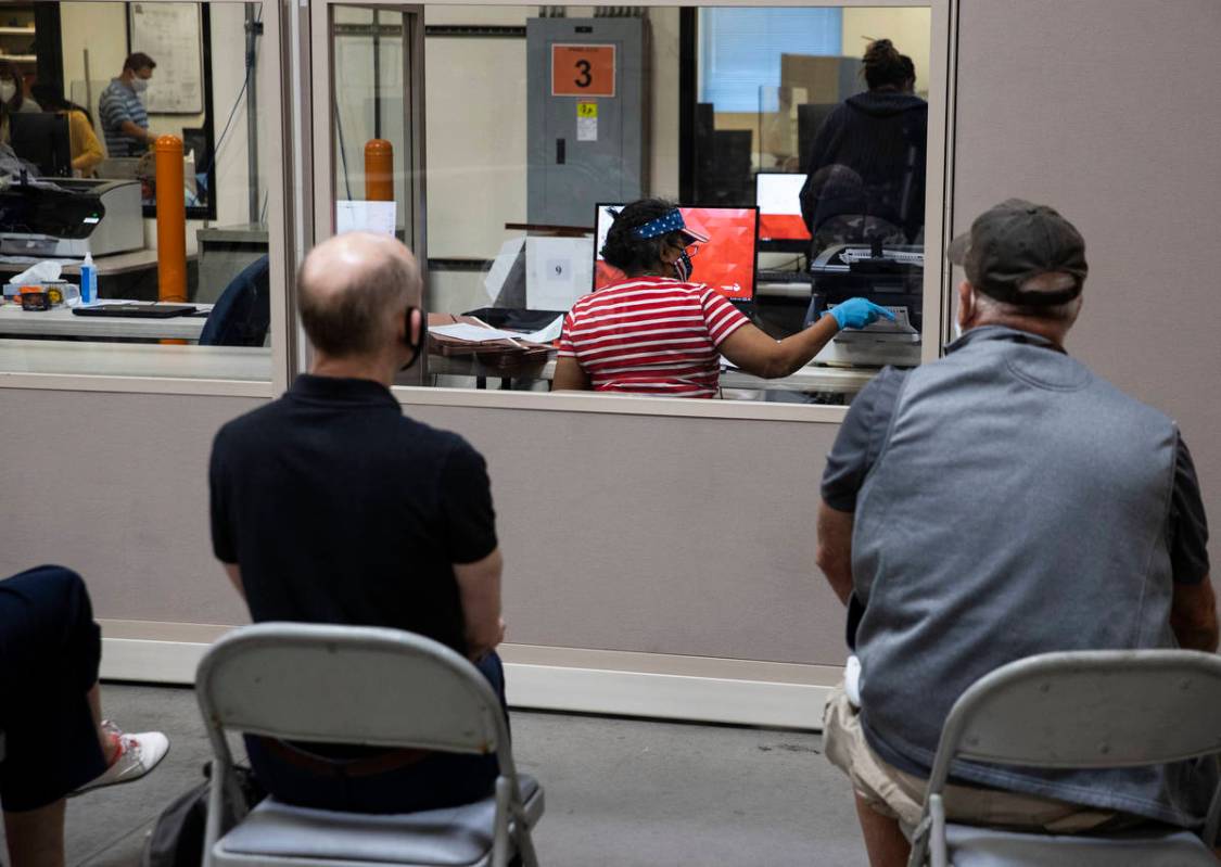 Election observers watch as Clark County election workers count ballots at the Election Departm ...
