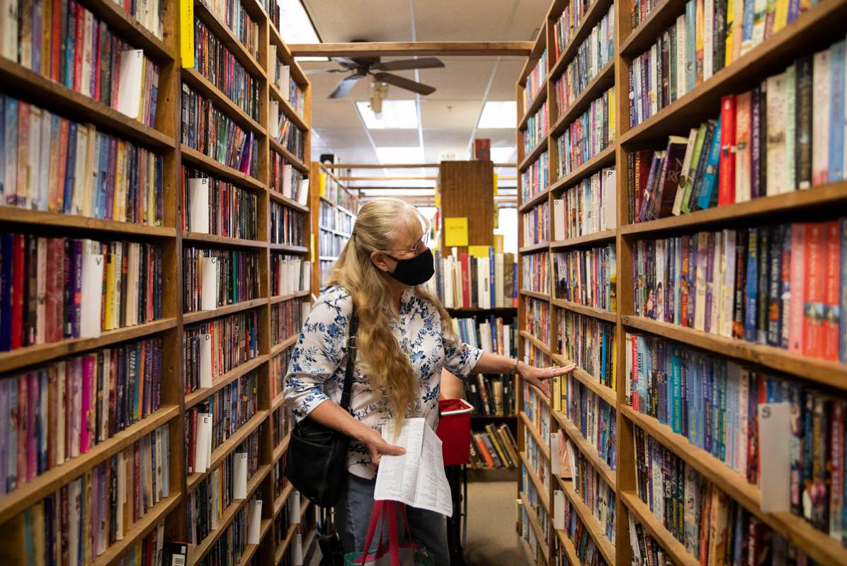 Barbara Mereness shops for books at Amber Unicorn Books in Las Vegas, Wednesday, Oct. 21, 2020. ...