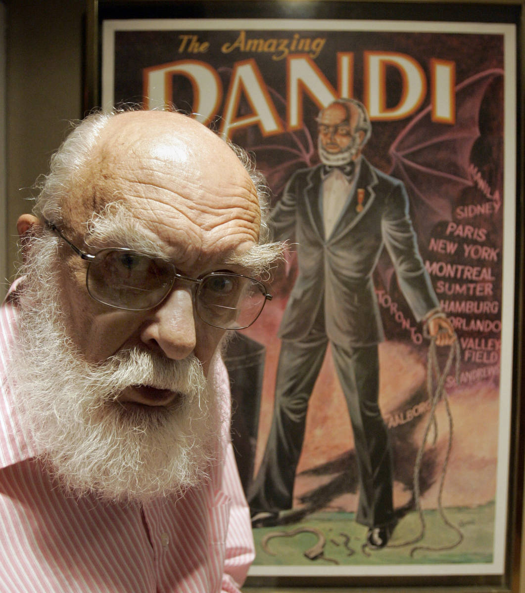 FILE - In this Friday, June 29, 2007, file photo, James Randi is shown in front of a poster at ...