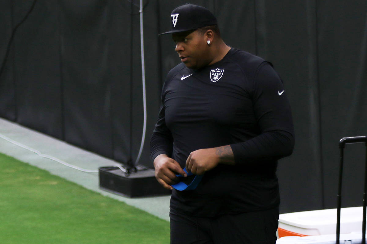 Las Vegas Raiders offensive tackle Trent Brown looks on during a team practice at Allegiant Sta ...