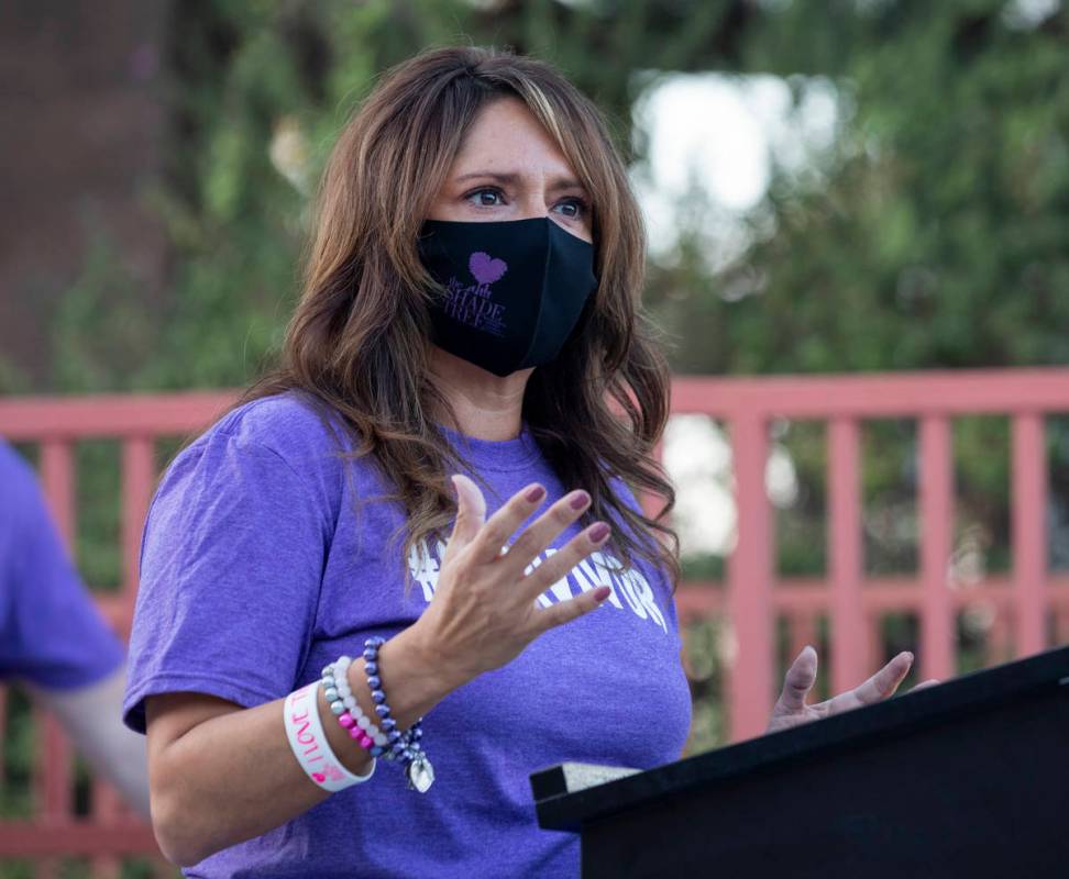 The Shade Tree CEO Linda Perez speaks before a candlelight vigil to honor domestic violence vic ...