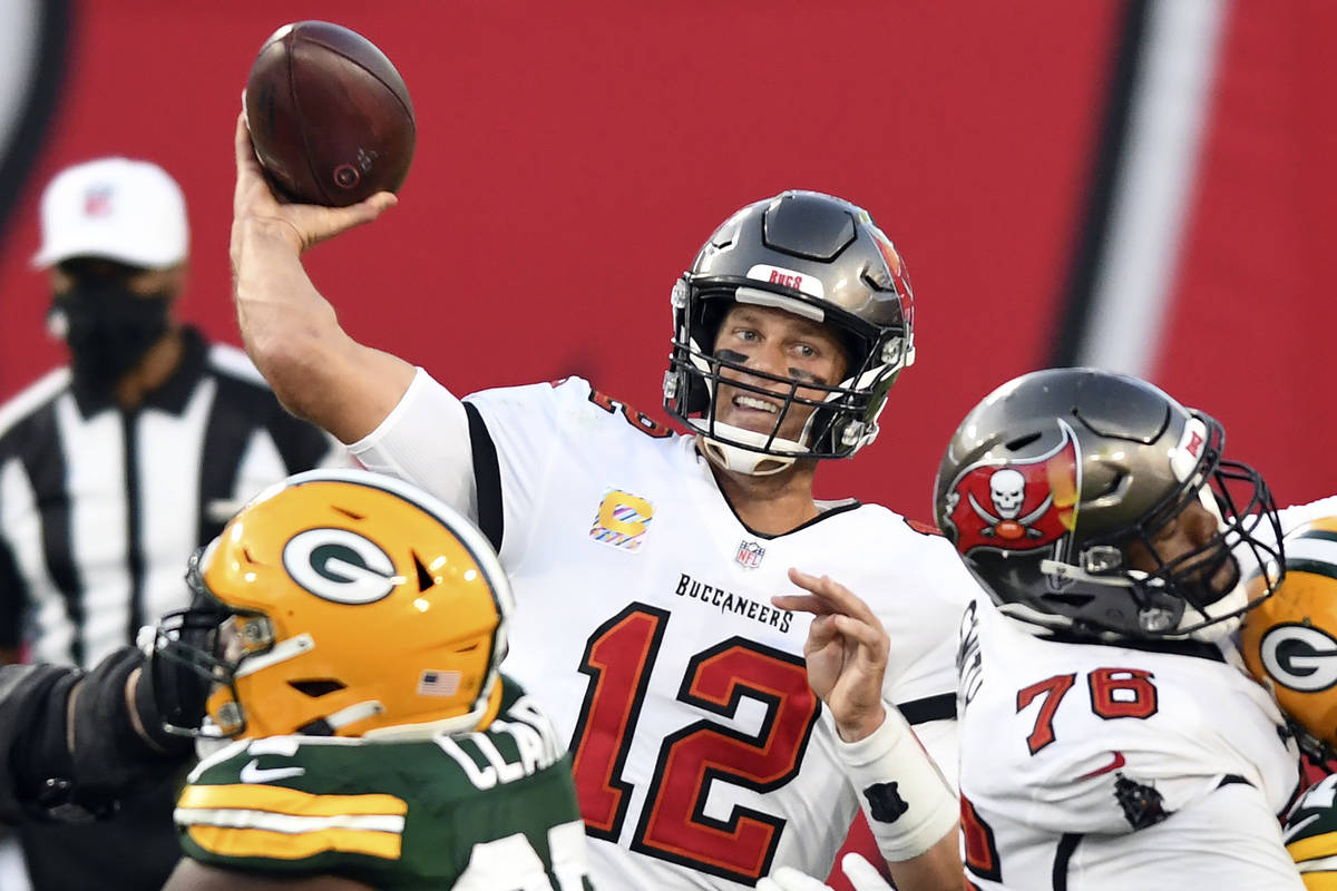 Tampa Bay Buccaneers quarterback Tom Brady (12) throws a pass against the Green Bay Packers dur ...