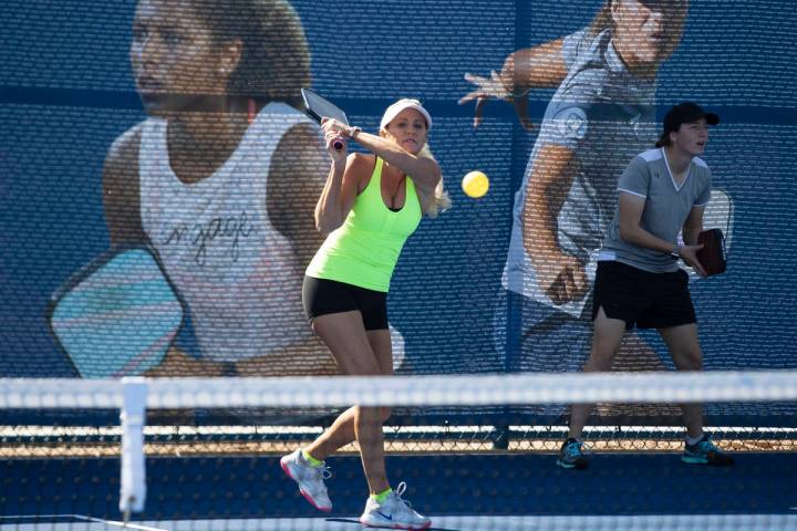 Christee Chargot of Astro, Fla., returns the ball to Jean Halaham of Washingtonville, N.Y., dur ...