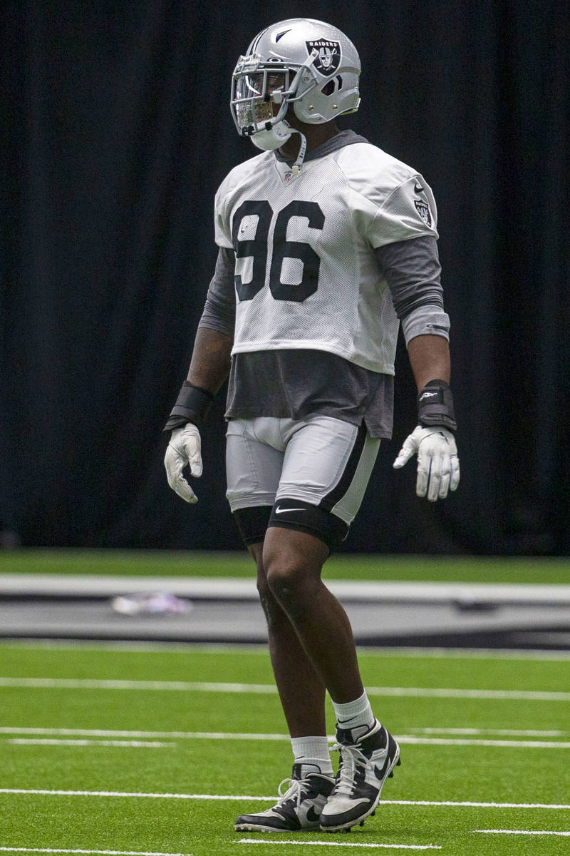 Las Vegas Raiders defensive end Clelin Ferrell (96) warms up during a practice session at the t ...