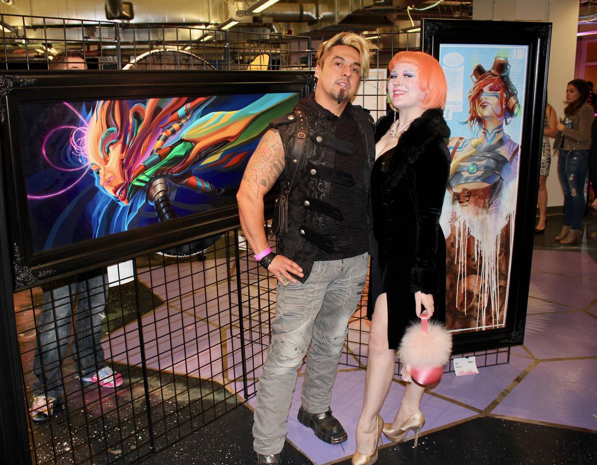 Artists Gear Duran and Heather Hermann pose with artwork. (AFAN)