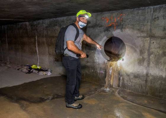 Crossroads CEO Dave Marlon looks at one of the water sources in a flood control tunnel near the ...