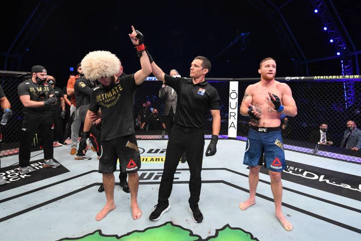 ABU DHABI, UNITED ARAB EMIRATES - OCTOBER 25: (L-R) Khabib Nurmagomedov of Russia celebrates h ...