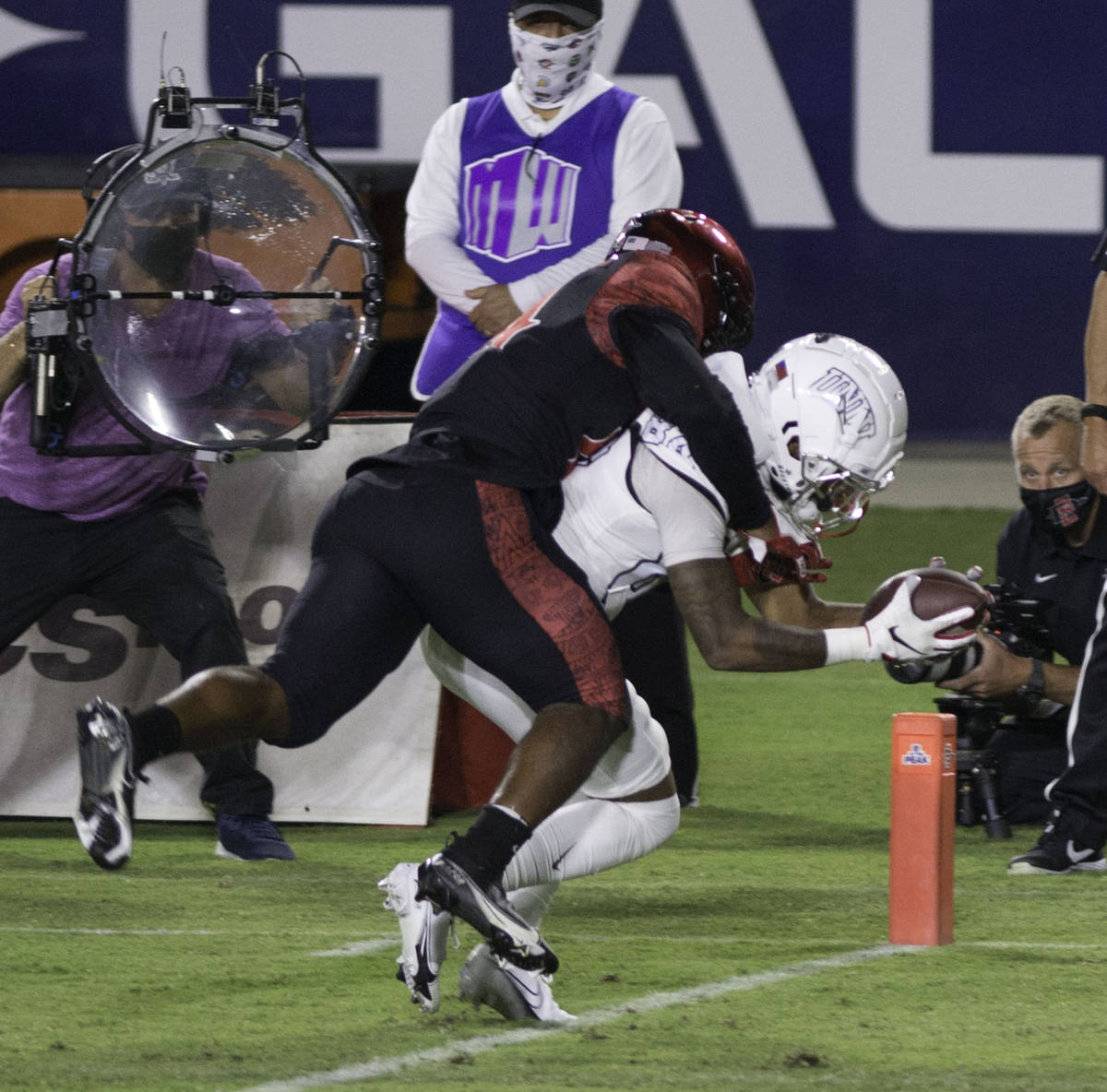 San Diego State’s Tariq Thompson tries to prevent the touchdown by UNLV’s Steve Jenkins dur ...