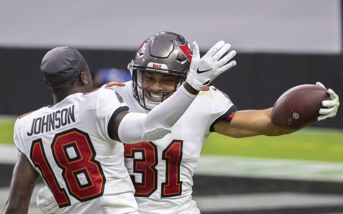Tampa Bay Buccaneers strong safety Antoine Winfield Jr. (31) celebrates with Tampa Bay Buccanee ...