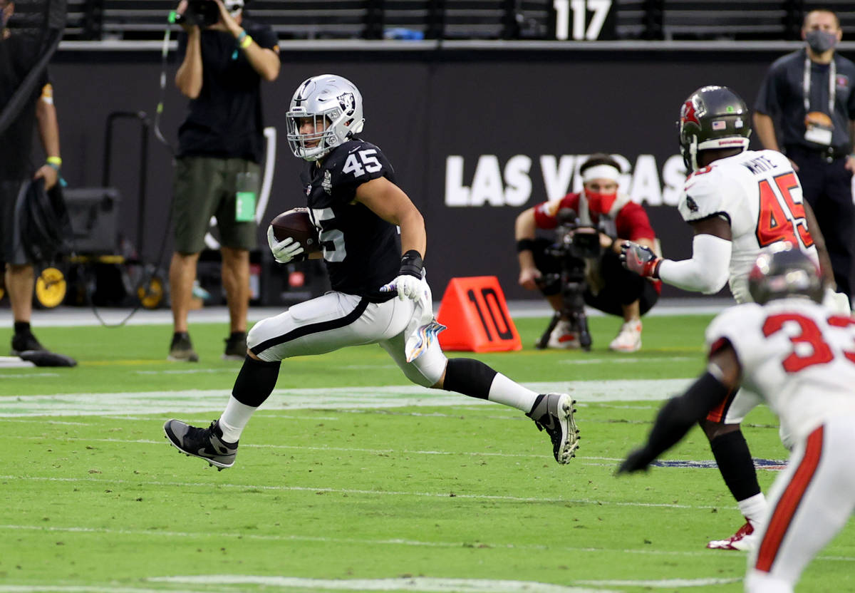 Las Vegas Raiders fullback Alec Ingold (45) runs the ball after making a catch in the second qu ...