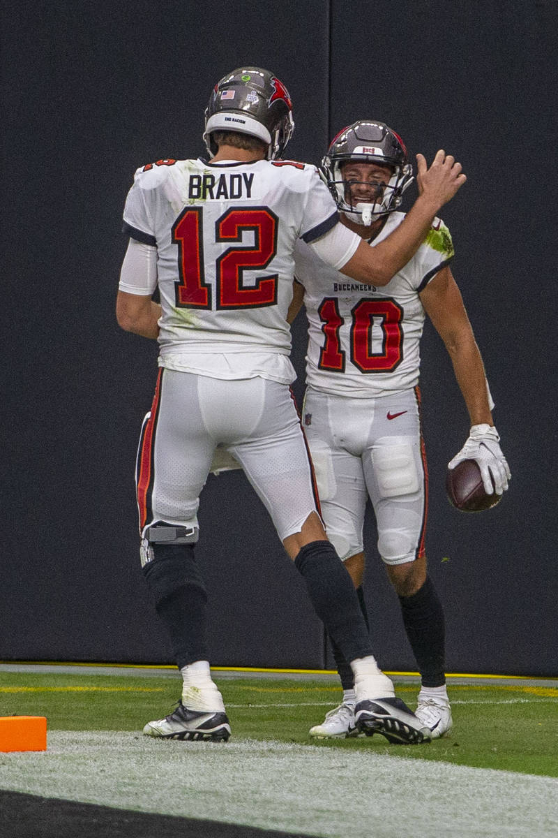 Tampa Bay Buccaneers wide receiver Scott Miller (10) celebrates his touchdown with quarterback ...