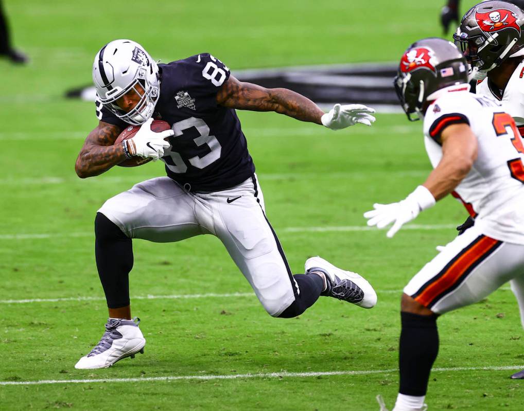 Las Vegas Raiders tight end Darren Waller (83) runs the ball against the Tampa Bay Buccaneers i ...