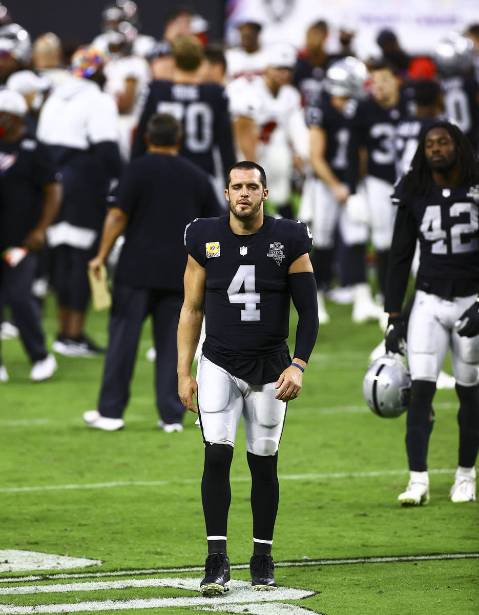 Las Vegas Raiders quarterback Derek Carr (4) walks off the field after an NFL football game on ...