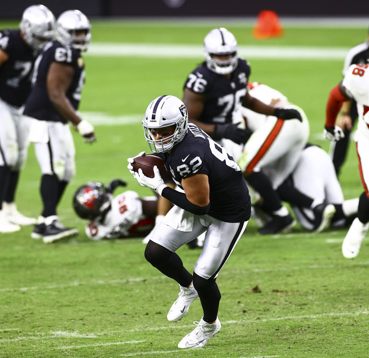 Las Vegas Raiders tight end Jason Witten (82) catches a pass in the fourth quarter during an NF ...