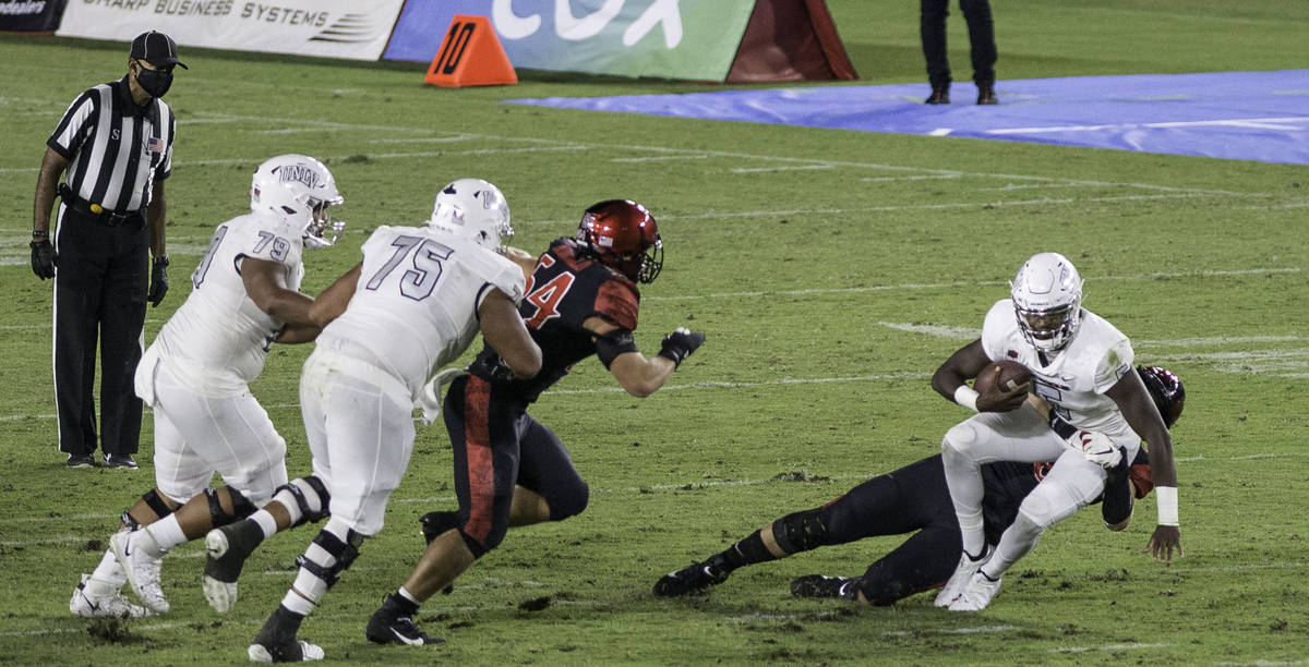 UNLV’s Justin Rogers is sacked by San Diego State’s Connor Mitchell during Saturday's Mount ...