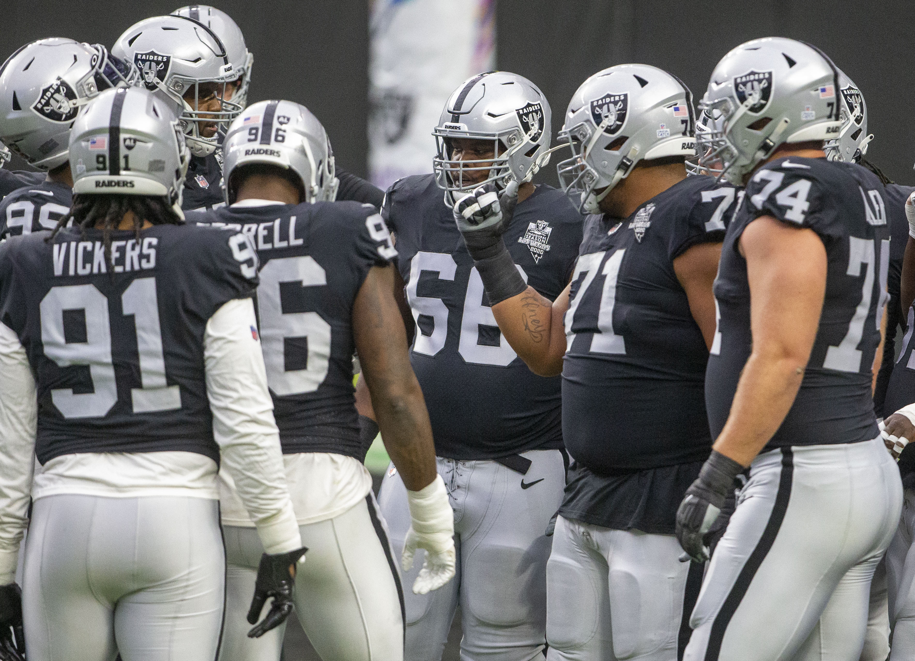 Las Vegas Raiders offensive guard Gabe Jackson (66) is seen gathered with defensive linemen and ...